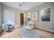 Bright office space featuring hardwood floors, modern decor, and natural light from the window at 11359 Winter Cottage Pl, Las Vegas, NV 89135