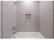Stylish shower area with horizontally textured tile, rainfall showerhead and built-in niche at 11359 Winter Cottage Pl, Las Vegas, NV 89135