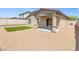Backyard with covered patio, xeriscape, and synthetic lawn at 13 Deseo Ct, North Las Vegas, NV 89031