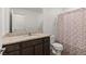 Bathroom featuring dark wood cabinets and granite countertops at 13 Deseo Ct, North Las Vegas, NV 89031