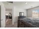 Bedroom with natural light, a dresser, and carpet flooring at 13 Deseo Ct, North Las Vegas, NV 89031