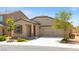 Charming single-story home with a two-car garage and desert landscaping at 13 Deseo Ct, North Las Vegas, NV 89031