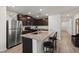 Modern kitchen featuring stainless steel appliances, granite counters, and a breakfast bar at 13 Deseo Ct, North Las Vegas, NV 89031