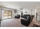 Bright living room with sliding doors leading to outdoor space at 13 Deseo Ct, North Las Vegas, NV 89031