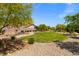 Community park with green grass, walking path, and seating area at 13 Deseo Ct, North Las Vegas, NV 89031