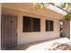 Exterior view of condo featuring security door and black tinted windows at 1361 E University Ave # 106, Las Vegas, NV 89119