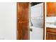 Convenient laundry closet featuring a stacked washer and dryer unit at 1361 E University Ave # 106, Las Vegas, NV 89119