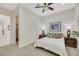 Bright bedroom featuring a ceiling fan, a plush bed, side tables, and ample natural light for comfort at 1805 Prichard Ave, Henderson, NV 89052