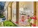 View of dining room with modern chandelier and beautiful backyard at 1805 Prichard Ave, Henderson, NV 89052