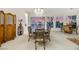 Elegant dining room featuring a chandelier, large windows, and decorative furniture at 1805 Prichard Ave, Henderson, NV 89052