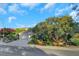 Charming single-story home featuring a three-car garage, tile roof, and lush, mature landscaping at 1805 Prichard Ave, Henderson, NV 89052