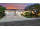Charming single-story home featuring a three-car garage, desert landscaping, and a tile roof at 1805 Prichard Ave, Henderson, NV 89052