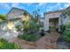 Beautiful home with meticulously landscaped front yard, concrete walkway, and arched windows at 1805 Prichard Ave, Henderson, NV 89052