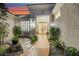 Beautiful desert home featuring double doors, a landscaped walkway, and custom shutters at 1805 Prichard Ave, Henderson, NV 89052