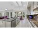 Open kitchen with white cabinetry, stainless appliances, and a center island overlooking the breakfast nook at 1805 Prichard Ave, Henderson, NV 89052