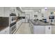 Contemporary kitchen featuring white cabinets, stainless steel appliances, and island with seating at 1805 Prichard Ave, Henderson, NV 89052