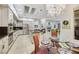 Open concept kitchen features granite counters, stainless steel appliances and decorative hanging lights at 1805 Prichard Ave, Henderson, NV 89052