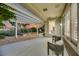 Covered patio with seating area overlooks a desert landscaped backyard with sunset views at 1805 Prichard Ave, Henderson, NV 89052