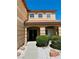 Close up of front door with covered entrance and meticulously maintained desert landscaping at 1904 Imola Ct, Las Vegas, NV 89123