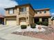 Charming two-story home with three-car garage, desert landscaping, and a welcoming facade at 1904 Imola Ct, Las Vegas, NV 89123