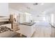 Modern kitchen features stainless steel appliances, island with black granite countertops and white cabinets at 1904 Imola Ct, Las Vegas, NV 89123