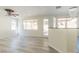 Spacious living room featuring gray wood flooring and lots of natural light at 1904 Imola Ct, Las Vegas, NV 89123