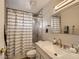 Well-lit bathroom with a shower/tub combination and a stylish vanity with a mirror at 2080 Karen Ave # 34, Las Vegas, NV 89169