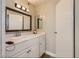 Bright bathroom with a white cabinet vanity, a decorative mirror, and a well-lit space at 2080 Karen Ave # 34, Las Vegas, NV 89169
