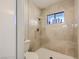 Updated bathroom featuring a tile shower with a glass window and modern fixtures at 2080 Karen Ave # 34, Las Vegas, NV 89169
