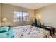 Cozy bedroom with a large window view, inviting bed, and a bedside table at 2080 Karen Ave # 34, Las Vegas, NV 89169