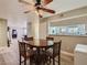 Open dining area with a view into the bright kitchen featuring a pass-through window at 2080 Karen Ave # 34, Las Vegas, NV 89169