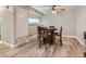 Inviting dining area with wood-look floors and a classic ceiling fan at 2080 Karen Ave # 34, Las Vegas, NV 89169