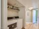 Convenient laundry room with washer, dryer, overhead storage, and a hallway entrance at 2080 Karen Ave # 34, Las Vegas, NV 89169