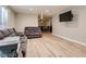 Inviting living room featuring new light wood floors, modern paint, and neutral-toned couches at 2080 Karen Ave # 34, Las Vegas, NV 89169