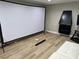 Bright living room featuring a projection screen and sleek, modern fireplace at 2080 Karen Ave # 34, Las Vegas, NV 89169