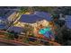 Aerial view showcasing a beautiful home with a pool, lush landscaping, and a covered patio at 2208 Point Rock Ln, Las Vegas, NV 89134
