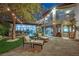 Inviting backyard featuring a covered patio, outdoor kitchen, and comfortable seating, ideal for entertaining at 2208 Point Rock Ln, Las Vegas, NV 89134