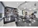 Basement wet bar featuring a black countertop and stainless steel appliances at 2208 Point Rock Ln, Las Vegas, NV 89134