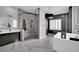 Modern bathroom with glass shower, soaking tub, and ample vanity space. A luxury retreat at 2208 Point Rock Ln, Las Vegas, NV 89134