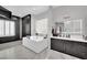 Relaxing bathroom featuring a luxurious soaking tub, double vanity, and ample storage space at 2208 Point Rock Ln, Las Vegas, NV 89134