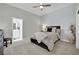 Bright bedroom with a ceiling fan, a neutral color palette, and an ensuite bathroom at 2208 Point Rock Ln, Las Vegas, NV 89134