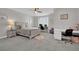 Bright bedroom featuring a bed, two desk areas for working, and large windows with blinds at 2208 Point Rock Ln, Las Vegas, NV 89134
