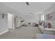 Spacious bedroom with three beds, a large sofa, stylish decor, and plush carpeting at 2208 Point Rock Ln, Las Vegas, NV 89134