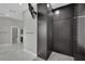 Spacious closet with custom shelving, cabinets, and a mounted television at 2208 Point Rock Ln, Las Vegas, NV 89134