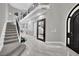 Spacious foyer with soaring ceilings, grand staircase, marble floors, and an elegant front door at 2208 Point Rock Ln, Las Vegas, NV 89134