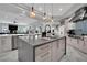 Bright, open kitchen with stainless appliances, a large island, and modern light fixtures at 2208 Point Rock Ln, Las Vegas, NV 89134