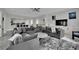 Spacious living room with a modern fireplace, large sectional couch, and an open floor plan at 2208 Point Rock Ln, Las Vegas, NV 89134