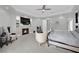An expansive main bedroom suite with fireplace, TV, sitting area, and tray ceilings at 2208 Point Rock Ln, Las Vegas, NV 89134