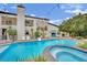 Stunning pool with spa and slide complementing the two-story home at 2208 Point Rock Ln, Las Vegas, NV 89134