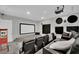 Home theater with tiered seating, a large screen, and a popcorn machine for movie nights at 2208 Point Rock Ln, Las Vegas, NV 89134